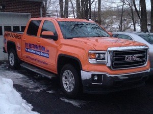 Water Damage Restoration Truck At Winter Flooding Site